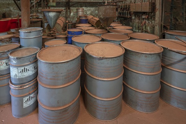 Metal drums for metal powder in the bronze powder filling room of a metal powder mill, founded in 1900, Igensdorf, Upper Franconia, Bavaria, Germany, Europe
