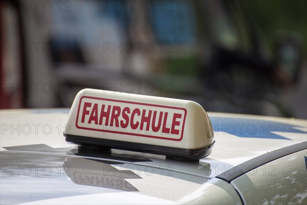 Close-up of a driving school sign in Germany