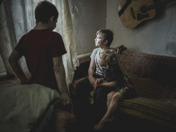 Sasha, 9 years old, Dima, 12 years old and Nastya, 5 years old. They live in the village of Borshchivka, which was occupied by the Russian army for over six months. They suffer from anxiety disorders, the front is only a few kilometres away as the crow flies, Borshchivka, Raion Isyum, Kharkiv Oblast, Ukraine, Europe