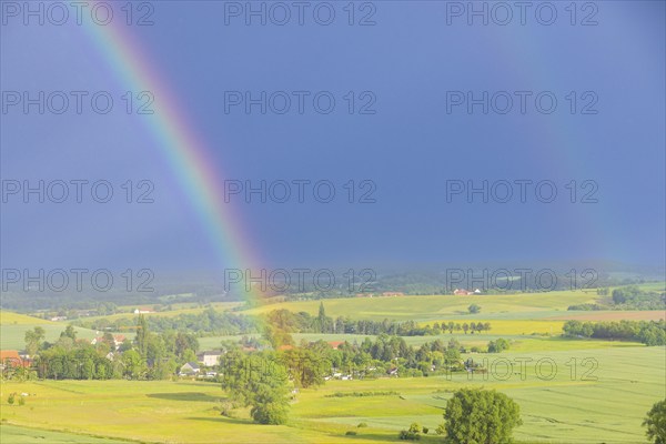 Thunderstorm cell with rainbow over fields near Krebs in the Osterzgebirge, Krebs, Saxony, Germany, Europe