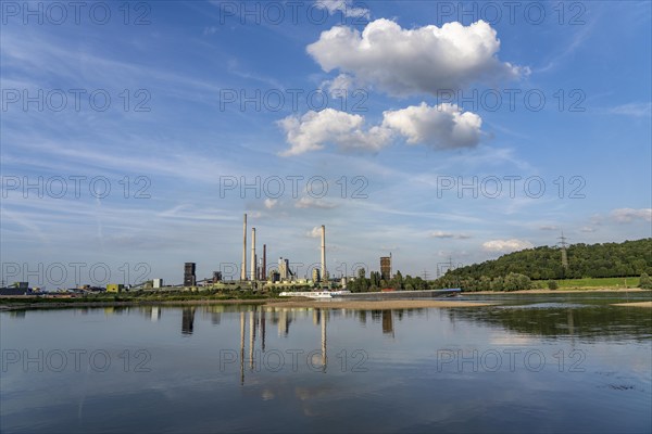 Industrial backdrop of the ThyssenKrupp Steel steelworks in Bruckhausen, on the Rhine, cargo ship, Schwelgern coking plant, Duisburg, North Rhine-Westphalia, Germany, Europe