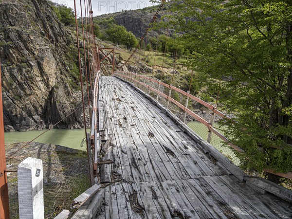 Old-style suspension bridge over Rio Mayer, on road X-905 from Villa o' Higgins to Paso Mayer, Patagonia, Chile, South America