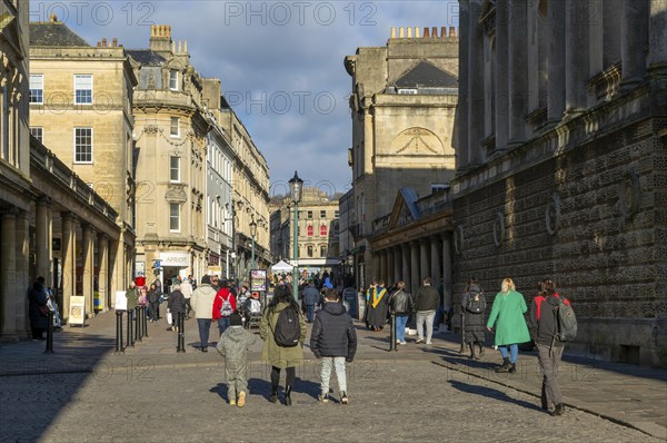 Shoppers walking in pedestrianised street in city centre, Union Street and Stall Street, Bath, Somerset, England, UK