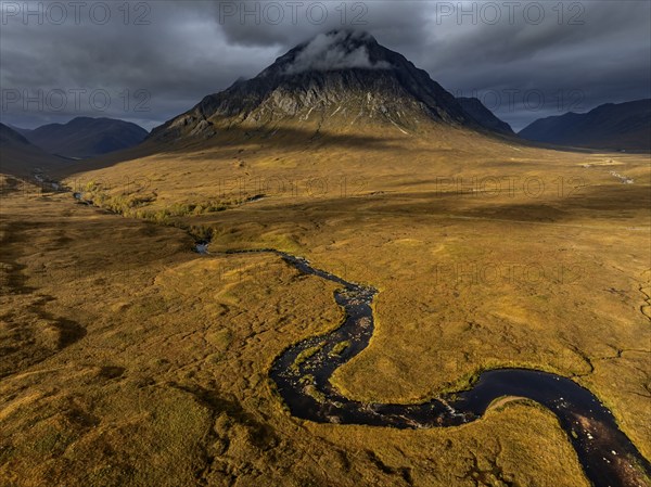 Morning light, cloudy mood, sunbeams, river, moor, mountain landscape, aerial view, autumn, view of Buachaille Etive Mòr, Glencoe, Scottish Highlands, Scotland, Great Britain