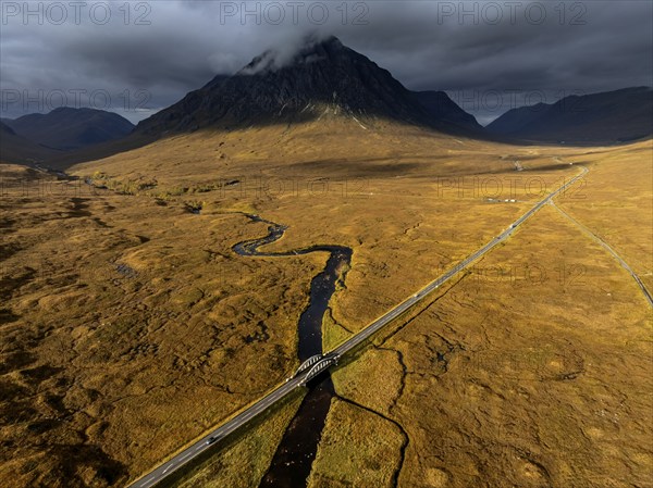 Morning light, cloudy mood, sunbeams, river, moor, mountain landscape, aerial view, road, autumn, view of Buachaille Etive Mòr, Glencoe, Scottish Highlands, Scotland, Great Britain