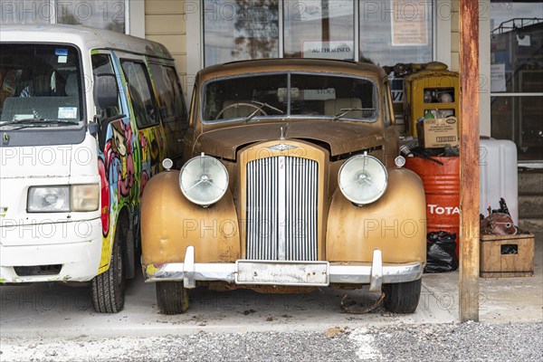 OHAKUNE, NEW ZEALAND, DECEMBER 23, 2022, Antique cars on a big scrapyard at the end of Old Coach Road Trail, North Island of New Zealand