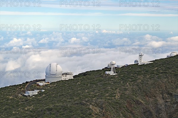 An observatory on a green hill with clouds and sky, trade winds, no light pollution, Observatory, Roques de los Muchachos, La Palma, Canary Islands, Spain, Europe
