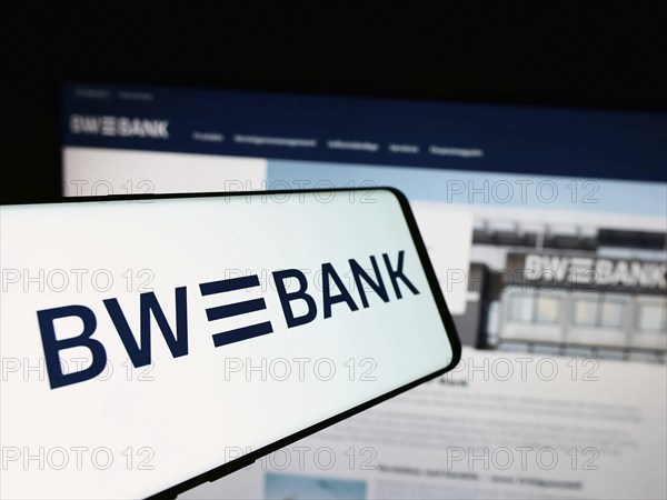 Stuttgart, Germany, 07-15-2024: Cellphone with logo of German company Baden-Württembergische Bank (BW-Bank) in front of business website. Focus on center of phone display, Europe