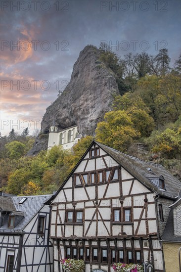 An old half-timbered town in autumn. A church was built into a rock here. Unique German architecture. Foggy landscape in the morning at the rock church, Idar-Oberstein, Rhineland-Palatinate, Germany, Europe