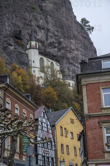 An old half-timbered town in autumn. A church was built into a rock here. Unique German architecture. Foggy landscape in the morning at the rock church, Idar-Oberstein, Rhineland-Palatinate, Germany, Europe