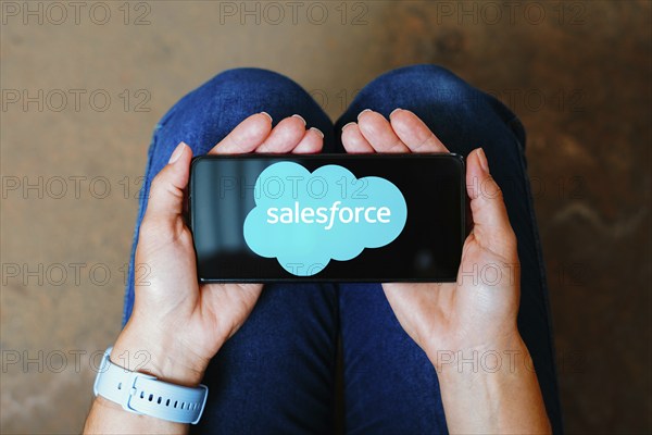 In this photo illustration, the Salesforce logo is displayed on a smartphone screen