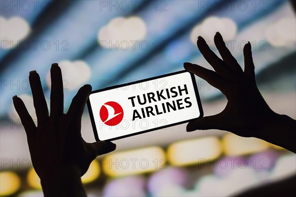 In this photo illustration, the Turkish Airlines logo is displayed on a smartphone screen