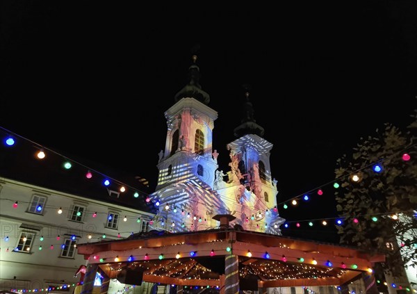 Beautiful Christmas decorations and Mariahilfer church, at night, in the city center of Graz, Styria region, Austria, Europe