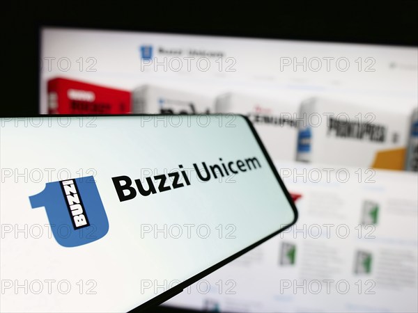 Stuttgart, Germany, 06-01-2024: Cellphone with logo of Italian building materials company Buzzi Unicem SpA in front of business website. Focus on left of phone display, Europe