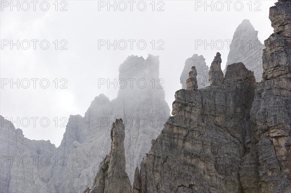 Mountain ridge in the mist in the Dolomites, Italy, Europe