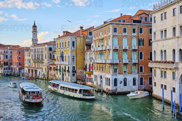 VENICE, ITALY, JUNE 27, 2018: Grand Canal with boats, vaporetto and gondolas on sunset from Rialto bridge, Venice, Italy, Europe