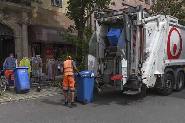 Emptying the blue paper bins by a private environmental service, Nuremberg, Middle Franconia, Bavaria, Germany, Europe