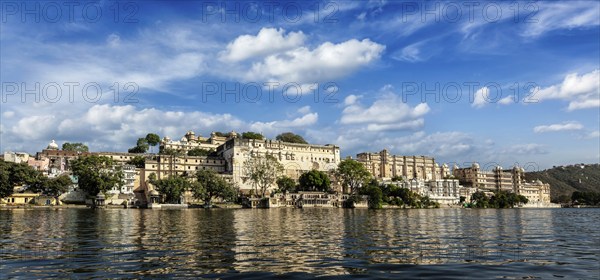 India luxury tourism concept background, panorama of Udaipur City Palace from Lake Pichola. Udaipur, Rajasthan, India, Asia