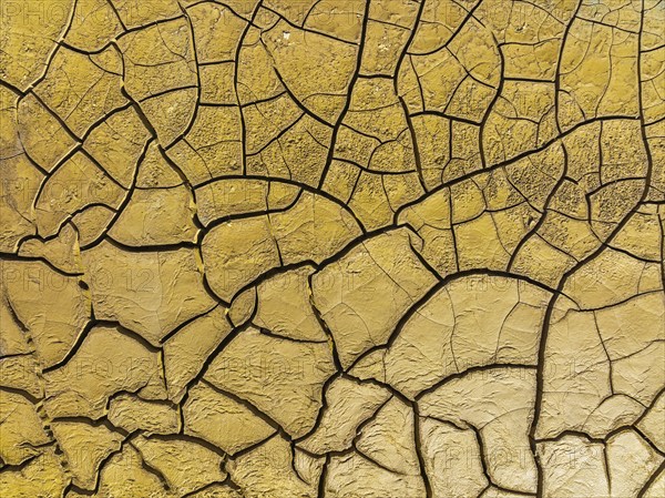 Mineral-rich cracked earth at the bank of the Rio Tinto (Red river), aerial view, drone shot, Huelva province, Andalusia, Spain, Europe