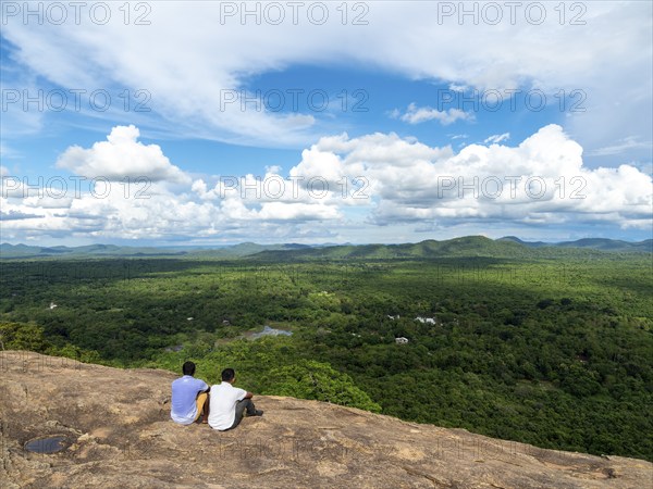 Men sitting on rocks, view of the landscape, Pidurangala, Sri Lanka, Asia
