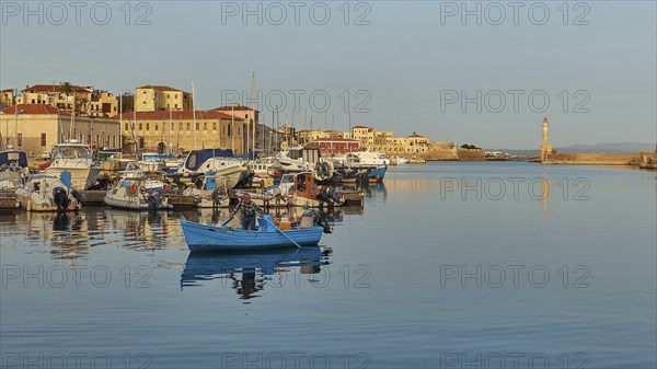 Venetian old town, Venetian harbour, Venetian lighthouse, fishing boat, fishermen in boat, boats, sailboats, calm sea, blue sea, grey-blue sea, blue cloudless sky, Chania, West Crete, island of Crete, Greece, Europe