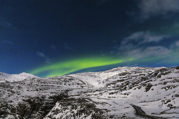 Northern Lights, Aurora Borealis, over snow-covered landscape at Skalafellsjökull, Sudurland, Iceland, Europe