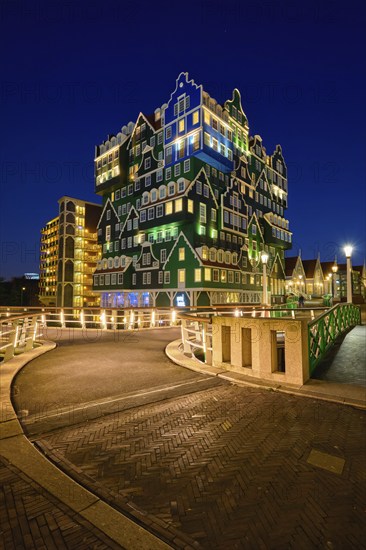 ZAANDAM, NETHERLANDS, MAY 8, 2017: Inntel Hotel in Zaandam illuminated at night. Design of 12-storey tall building opened in 2009 is the result of stacking a series of traditional Dutch houses