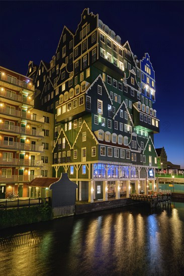 ZAANDAM, NETHERLANDS, MAY 8, 2017: Inntel Hotel in Zaandam illuminated at night. Design of 12-storey tall building opened in 2009 is the result of stacking a series of traditional Dutch houses