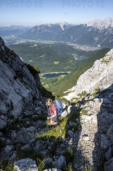 Climber on the ascent to the Westliche Wettersteinspitze, Wetterstein Mountains, Bavaria, Germany, Europe