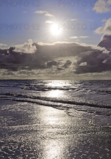 Outgoing tidal fringe in the mudflat landscape with dramatic clouds, North Sea, Norderney Island, East Frisia, Lower Saxony, Germany, Europe