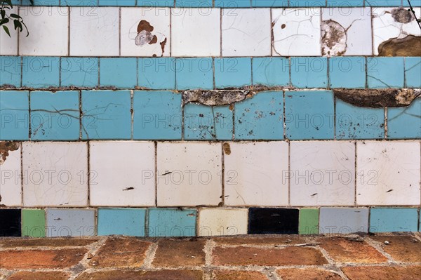 Broken wall in a swimming pool, cracks, wall tiles, dilapidated swimming pool, lost place, full format, Spain, Europe