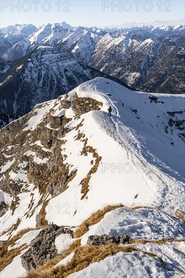 Ski tourers at the summit of Schafreuter, view of snow-covered mountain panorama, Karwendel, Tyrol, Austria, Europe