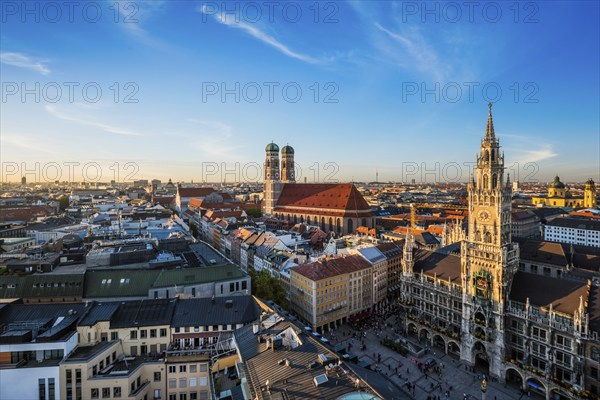 Aerial view of Munich, Marienplatz, Neues Rathaus and Frauenkirche from St. Peter's church on sunset. Munich, Germany, Europe