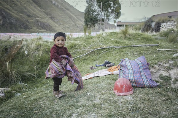 Child of a miner in an open pit kaolin mine, Pachacayo, Peru, South America