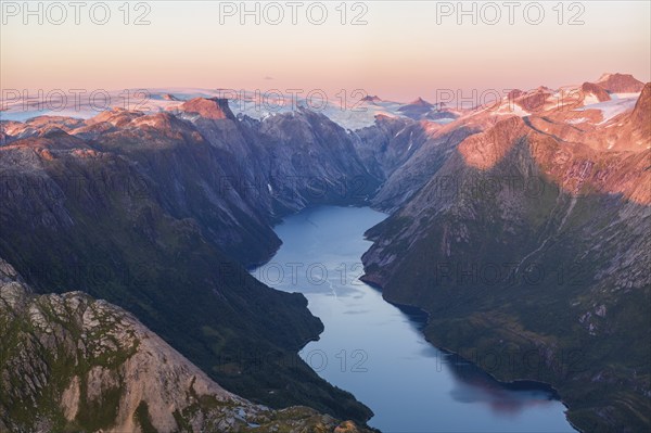 View from Seiskallåfjellet into the Nordfjorden, evening mood, Svartisen Glacier in the background, Saltfjellet Svartisen National Park, Helgeland Coast, Rødøy, Nordland, Norway, Europe
