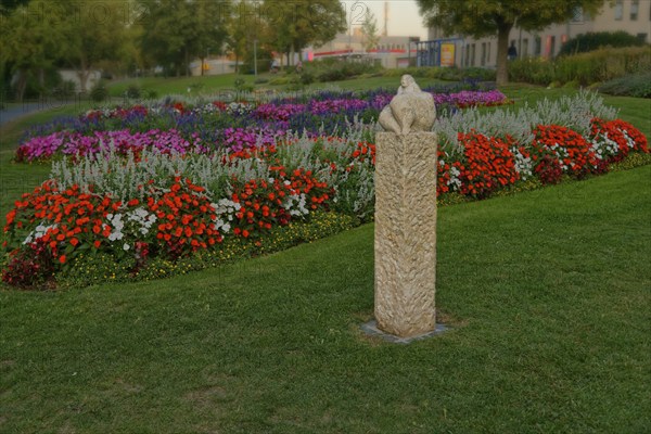The sculpture Venus of Amberg surrounded by a colourful flower bed in the municipal park, Amberg, Upper Palatinate, Bavaria, Germany, Europe