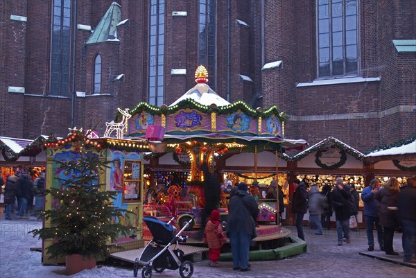 Europe, Germany, Hamburg, Christmas market in front of St Peter's Church, Children's carousel, Europe