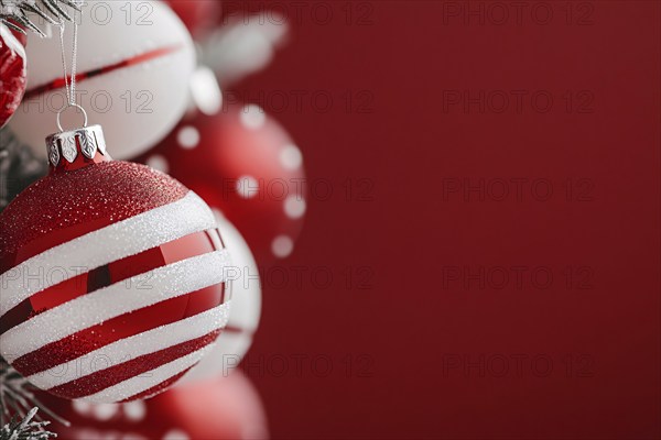 Christmas bauble ornament with red and white stripes on tree with copy space. Generative AI, AI generated