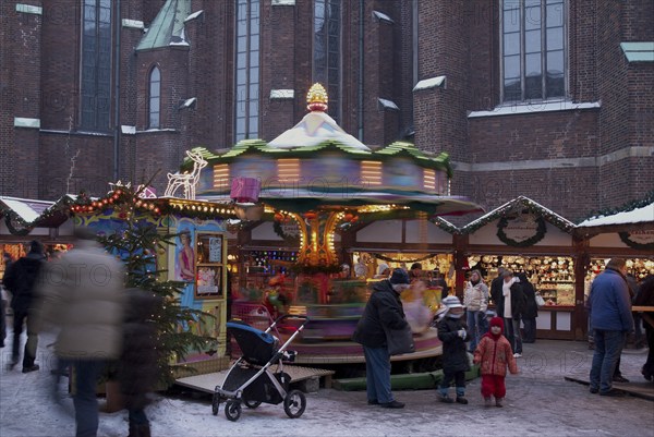 Europe, Germany, Hamburg, Christmas market in front of St Peter's Church, Children's carousel, Europe