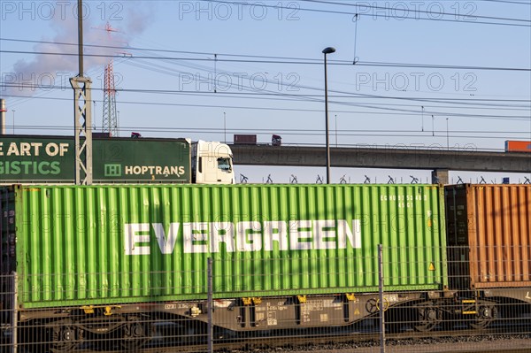 Ramp to, from the Köhlbrand Bridge in the Port of Hamburg, back, front trucks on the Waltershoferdam, access to the HHLA Container Terminal Burchardkai, middle traffic on the A7 motorway, front goods train route to, from the HHLA Container Terminal Burchardkai, spans the 325 m wide Köhlbrand, an arm of the Süderelbe, the bridge is over 3600 metres long, 53 metres above the water, piers 135 m high, more than 30.000 vehicles use the B3 bridge daily, important connection to the harbour, it is dilapidated, to be rebuilt, Hamburg, Germany, Europe
