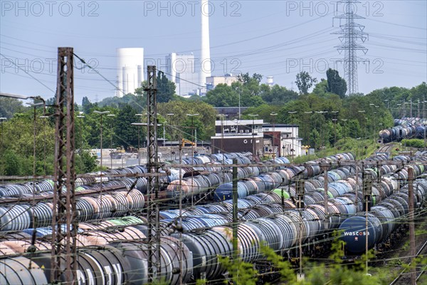 Gelsenkirchen Bismarck marshalling yard, goods trains are assembled and shunted here, tank wagons for transporting chemicals and mineral oil products, in the background the STEAG combined heat and power plant in Herne, North Rhine-Westphalia, Germany, Europe