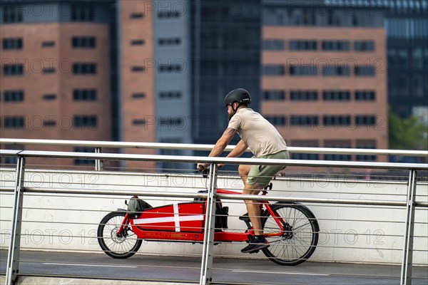 Cyclists on the Bryggebroen cycle and footpath bridge over the harbour, Sydhavnen, Copenhagen is considered the cycling capital of the world, 45 % of the population travel by bike, Denmark, Europe