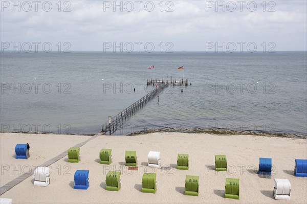 Flooded jetty, beach chairs on sandy beach, North Sea coast, Wyk, Föhr, North Sea island, North Frisia, Schleswig-Holstein, Germany, Europe