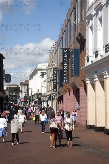 Shoppers walking in a pedestrianised shopping area in the town centre of Ipswich, Suffolk, England, UK