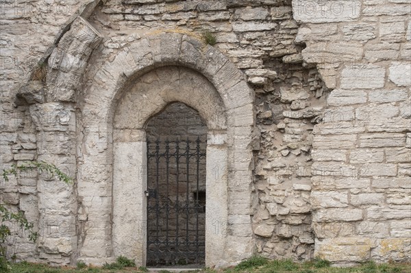 Wrought-iron door, wall, church ruins, Hanseatic city of Visby, UNESCO World Heritage Site, Gotland Island, Sweden, Europe