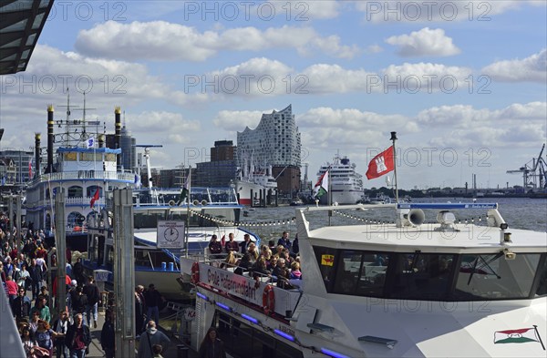 Europe, Germany, Hanseatic City of Hamburg, Elbe, Elbe Philharmonic Hall, glass facade, harbour tour with harbour ferry, many tourists, passenger ship Europa at the Überseebrücke, Hamburg, Hamburg, Federal Republic of Germany, Europe