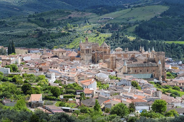 Views of the old town centre with characteristic architecture and green hills in the background, Guadalupe, Cáceres province, Caceres, Extremadura, Spain, Europe