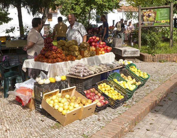 Selling chestnuts at a fruit and vegetable market stall in the village of Galaroza, Sierra de Aracena, Huelva province, Spain, Europe