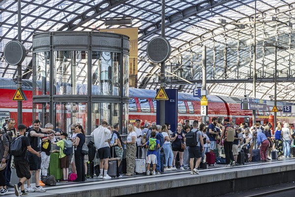 Central station with glass roof construction, crowds of people on the platform, regional train, Berlin, Germany, Europe