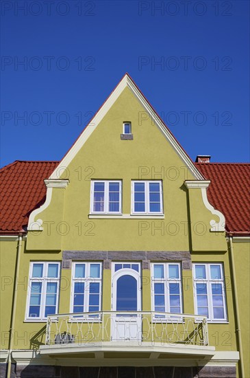 House gable with red tiled roof and white windows against a clear blue sky, Molde, Romsdal, Norway, Europe